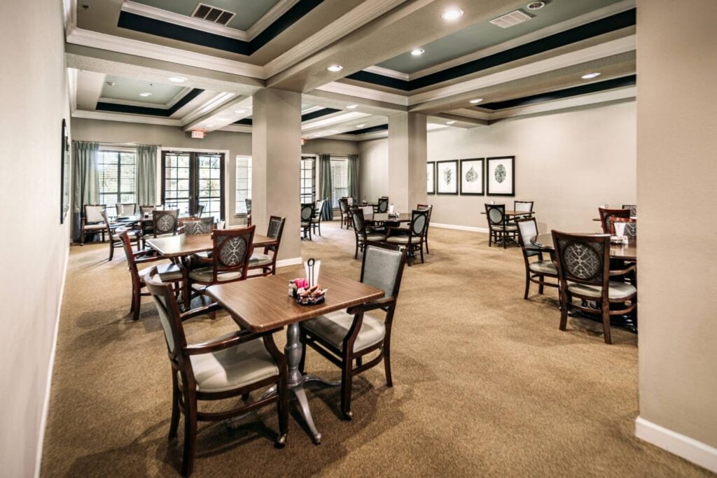 Elegant Resident Dining Room With Coffered Ceilings at an Assisted Living Facility