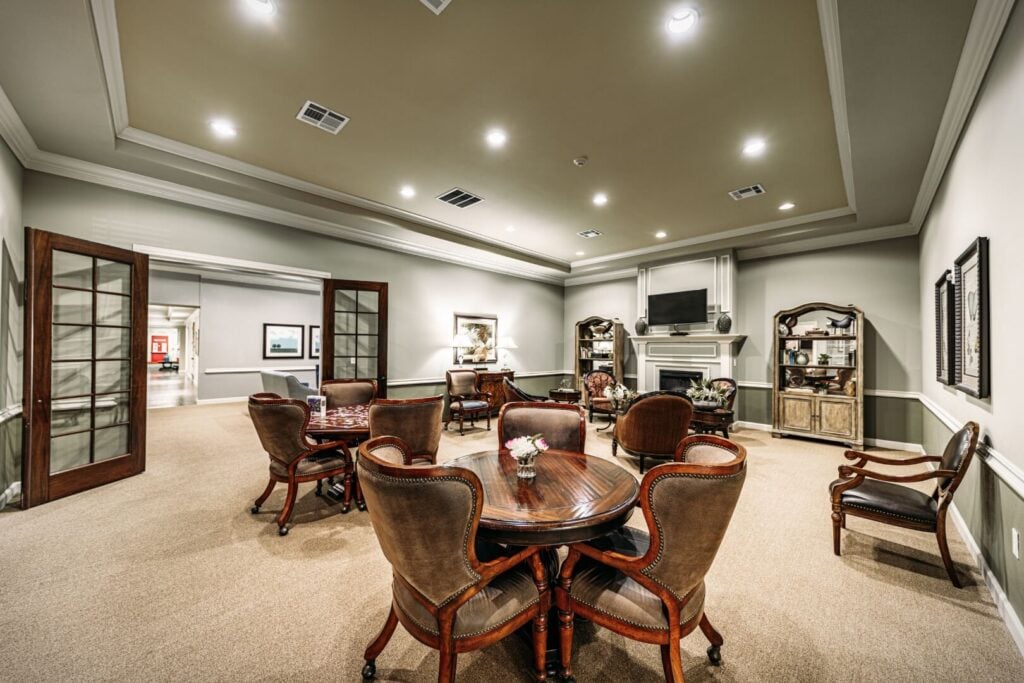 Warm and Inviting Resident Lounge With Fireplace at an Assisted Care Community
