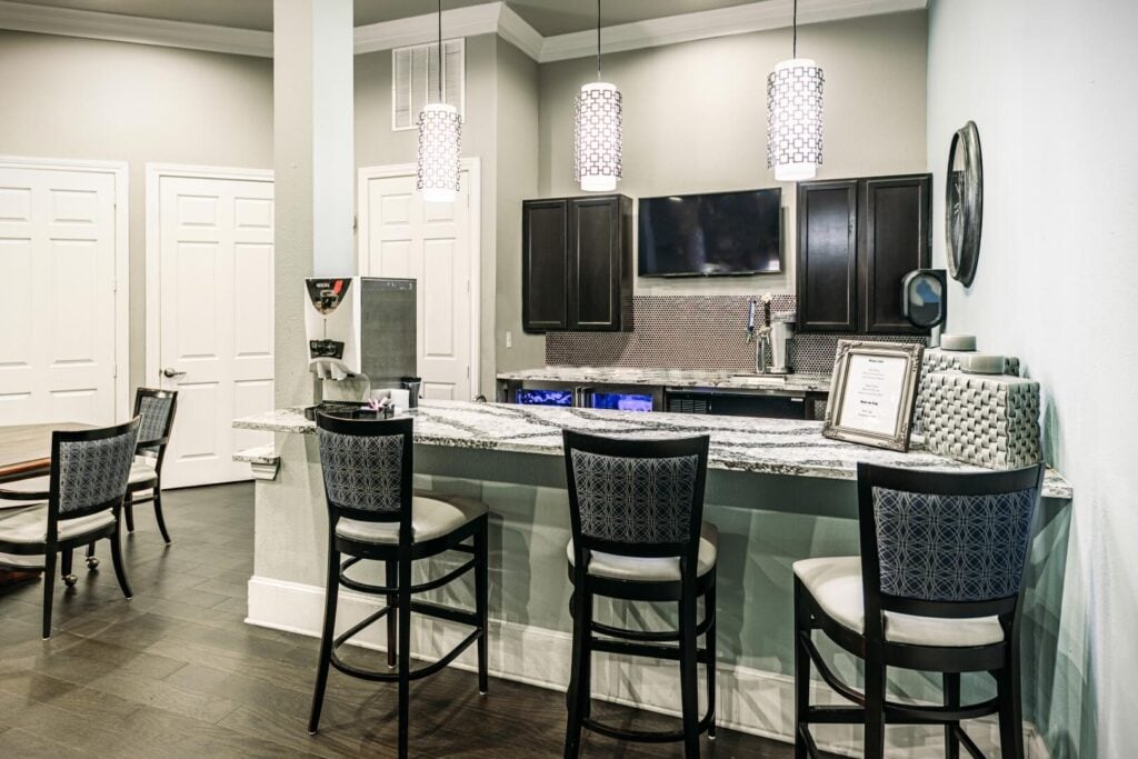 Stylish Resident Lounge and Bar Area for Social Gatherings at a Memory Care Community