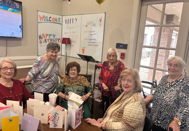 Elderly Residents Celebrating a Birthday Together at an Independent Living Community Elderly Residents Celebrating a Birthday Together at an Independent Living Community